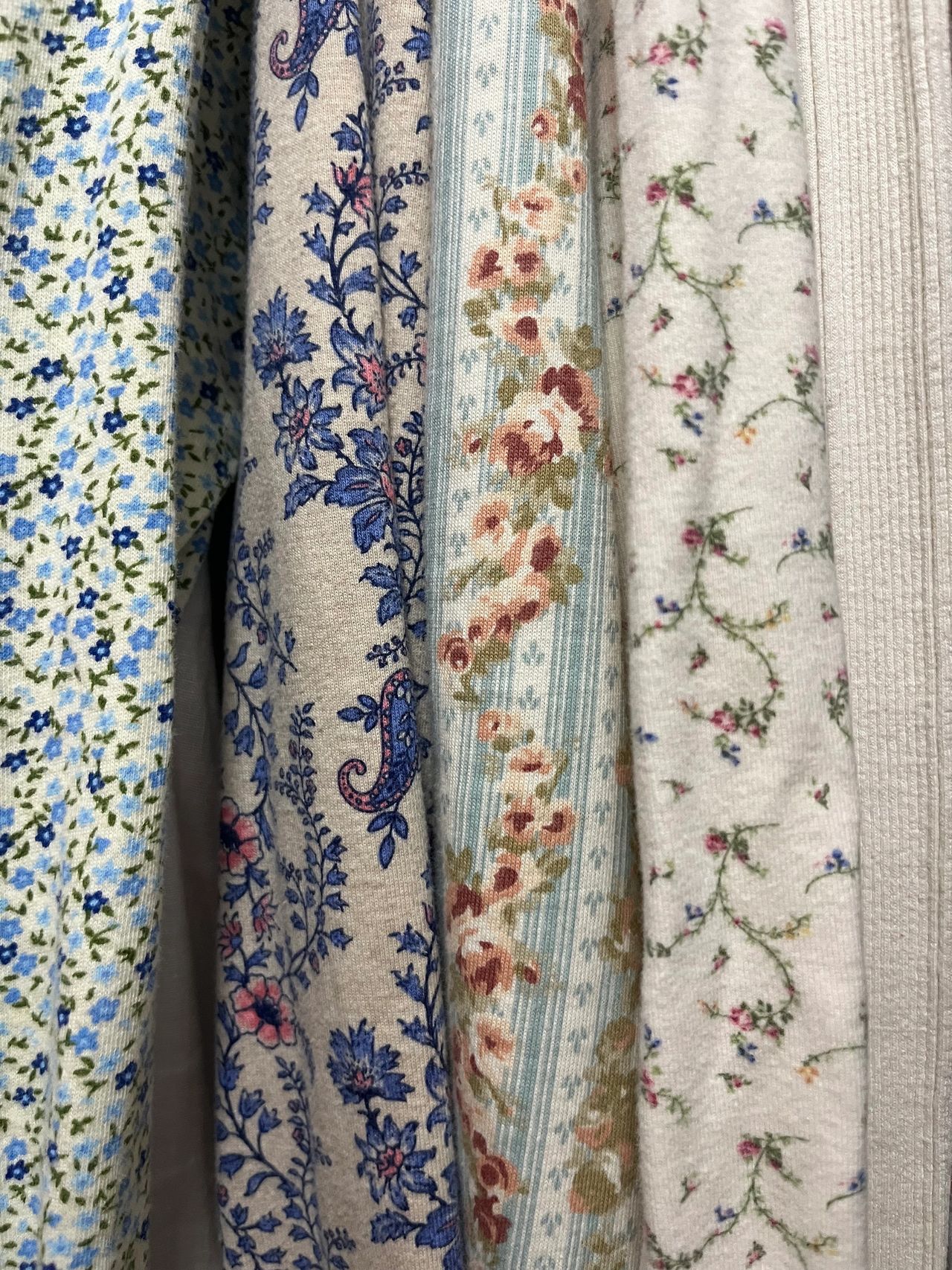 A peek at the cotton knits in my closet; Not every fabric here is designer, but they all have some common threads! (leafy designs, dainty florals, hues of blues, pinks and greens...Bunny was right!)